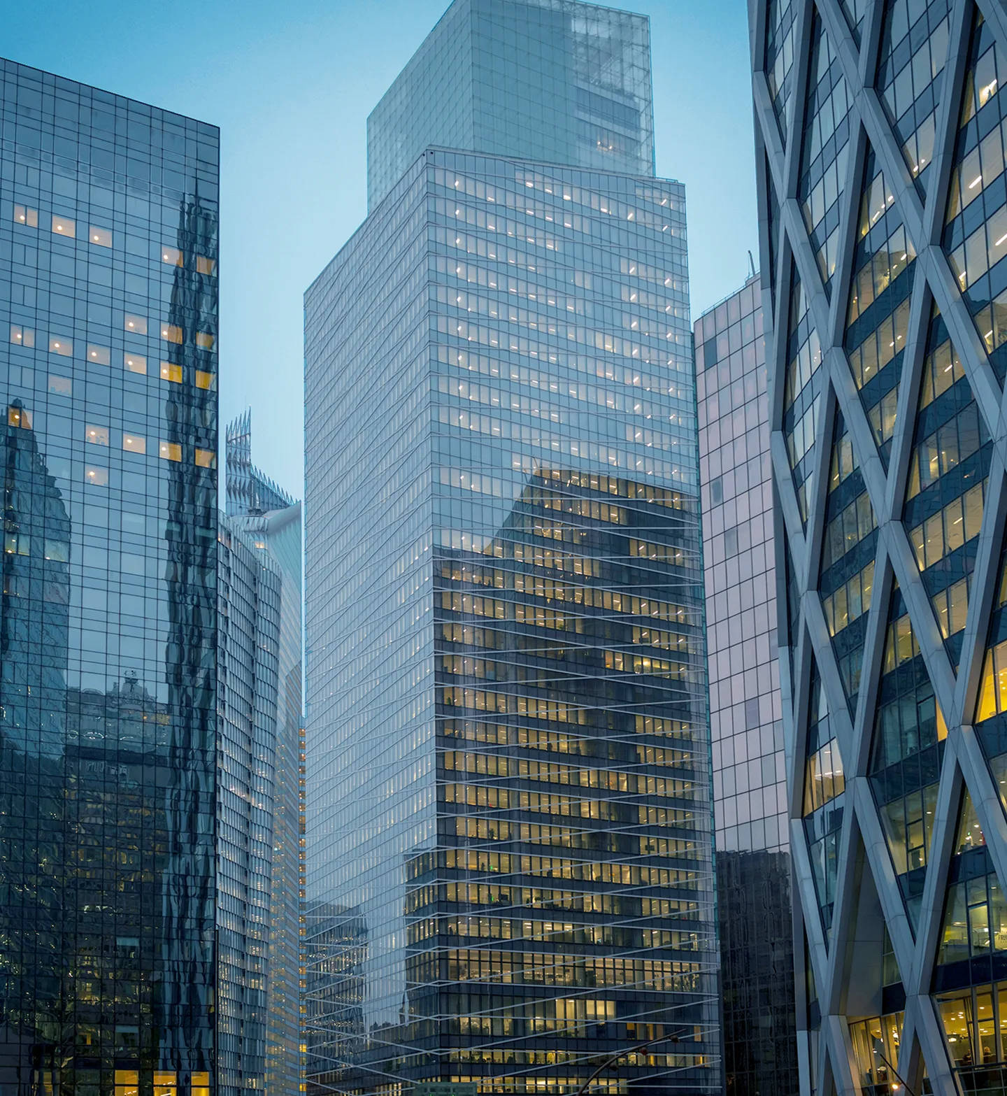 Glass office towers with lit floors at dusk
